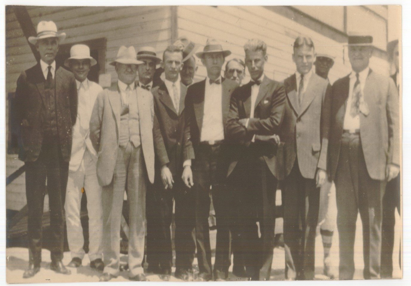 In front of the Watanabe Hotel (left to right) are Mr. Thomas, A. C. Clewis – Founder of Clewiston, E. L. Stewart – director/cashier, J. A. Griffin, C. C. Whitaker – Early Stockholder, C. V. Parkinson – director/president, Bill Lee, John Sam Cottrell – director/vice president, E. C. Cole – Clewiston Company (owned real estate of Clewiston), Dick Griffin – Exchange Bank of Tampa, Ike Kraft – brother-in-law of A. C. Clewis, Peter O. Knight – early stockholder Chief Woodward – Tampa law enforcement officer. [Photo courtesy First Bank]